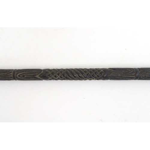 1468 - An Indian ebony walking cane / stick with carved detail. Approx. 32 1/2