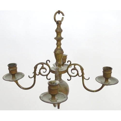 2240 - A pair of Dutch brass pendant chandeliers, the  candle sconces supported on four scrolling branches.... 