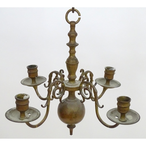 2240 - A pair of Dutch brass pendant chandeliers, the  candle sconces supported on four scrolling branches.... 