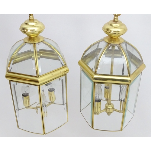 2241 - A set of 4 late 20thC pendant lights, the three branch lights hexagonal formed lantern shades with b... 