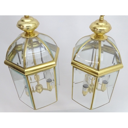 2241 - A set of 4 late 20thC pendant lights, the three branch lights hexagonal formed lantern shades with b... 