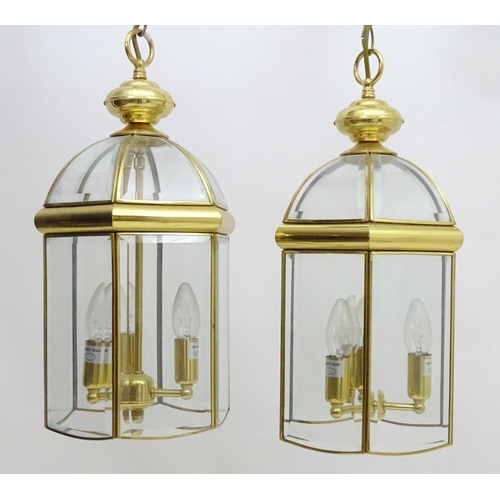 2241 - A set of 4 late 20thC pendant lights, the three branch lights hexagonal formed lantern shades with b... 