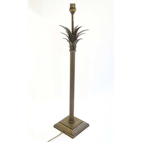 2253 - A Jim Lawrence table lamp, the reeded column surmounted by flared leaf detail. Approx 26