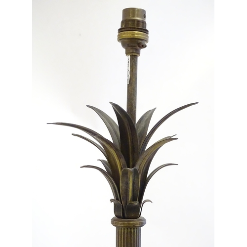 2253 - A Jim Lawrence table lamp, the reeded column surmounted by flared leaf detail. Approx 26