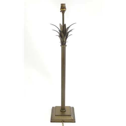 2253 - A Jim Lawrence table lamp, the reeded column surmounted by flared leaf detail. Approx 26