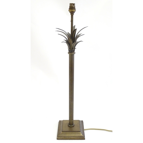 2253 - A Jim Lawrence table lamp, the reeded column surmounted by flared leaf detail. Approx 26