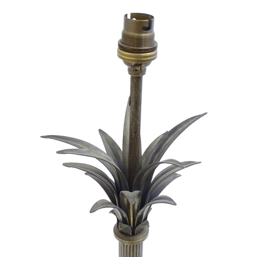 2253 - A Jim Lawrence table lamp, the reeded column surmounted by flared leaf detail. Approx 26