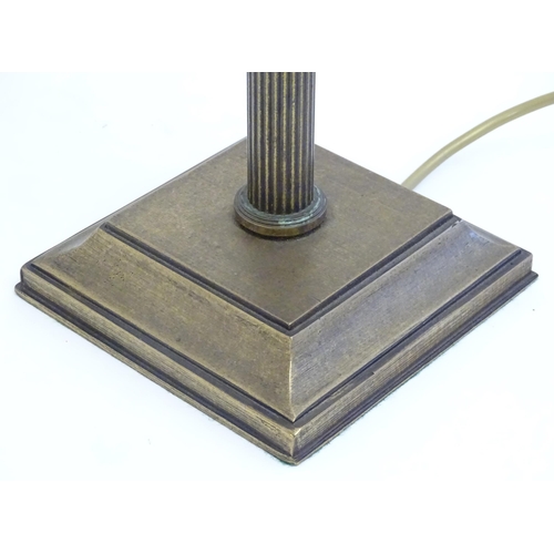 2253 - A Jim Lawrence table lamp, the reeded column surmounted by flared leaf detail. Approx 26