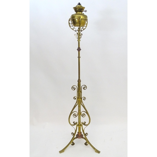 2261 - An 1891 Benham & Froud brass and copper tripod standard lamp in the manner of Dr C Dresser. bearing ... 