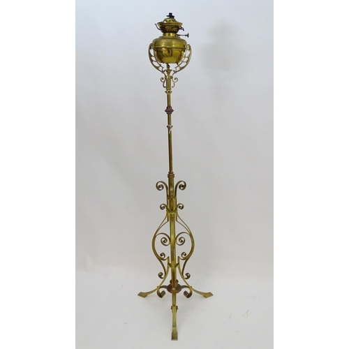 2261 - An 1891 Benham & Froud brass and copper tripod standard lamp in the manner of Dr C Dresser. bearing ... 