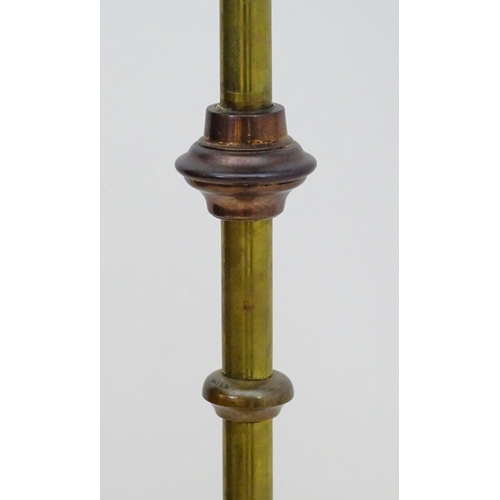 2261 - An 1891 Benham & Froud brass and copper tripod standard lamp in the manner of Dr C Dresser. bearing ... 