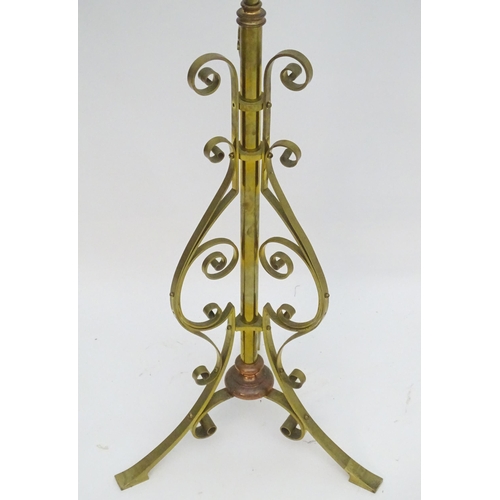 2261 - An 1891 Benham & Froud brass and copper tripod standard lamp in the manner of Dr C Dresser. bearing ... 