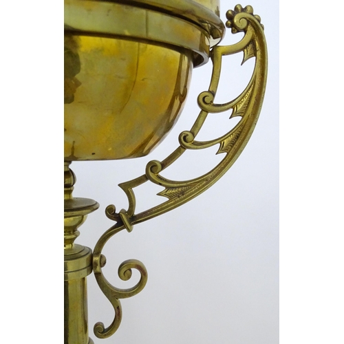 2261 - An 1891 Benham & Froud brass and copper tripod standard lamp in the manner of Dr C Dresser. bearing ... 