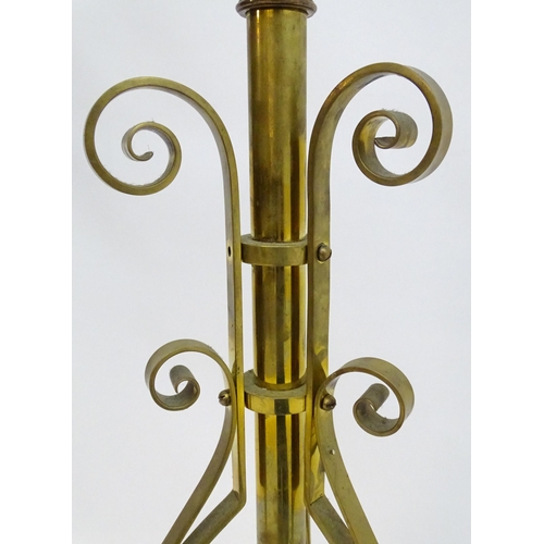 2261 - An 1891 Benham & Froud brass and copper tripod standard lamp in the manner of Dr C Dresser. bearing ... 