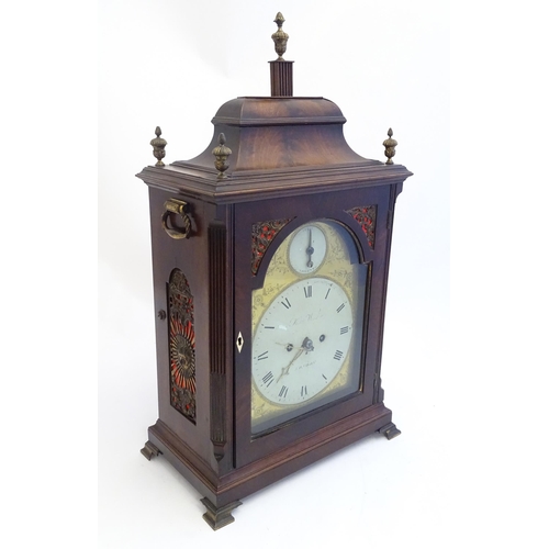 2282 - A mahogany cased bracket clock, the brass and enamel break arch dial signed ' Robt Wood , London ' a... 