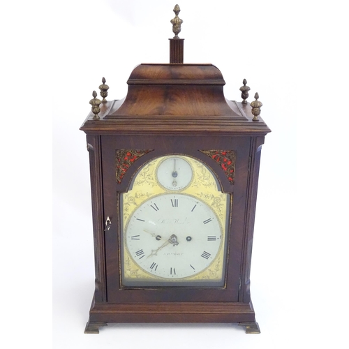 2282 - A mahogany cased bracket clock, the brass and enamel break arch dial signed ' Robt Wood , London ' a... 