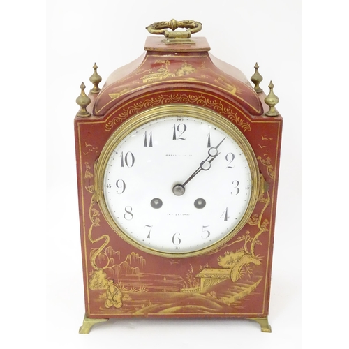 2283 - Maple & Co : A mantle clock with white enamel dial signed Maple & Co Ltd Paris London within a red l... 