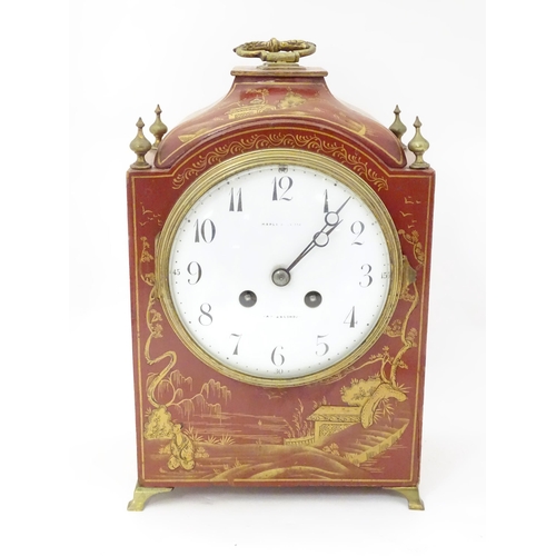 2283 - Maple & Co : A mantle clock with white enamel dial signed Maple & Co Ltd Paris London within a red l... 