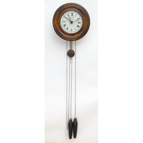 2287A - A postmans alarm style wall clock  with cast black forest style pine cone weights. The movement surm... 