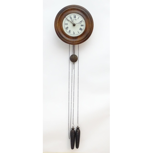 2287A - A postmans alarm style wall clock  with cast black forest style pine cone weights. The movement surm... 