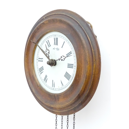 2287A - A postmans alarm style wall clock  with cast black forest style pine cone weights. The movement surm... 