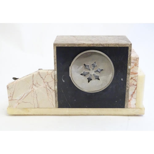 2288 - An Art Deco onyx and marble mantle clock with cased figure of seated Pierrot. The clock dial signed ... 