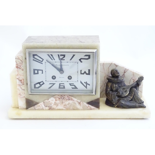 2288 - An Art Deco onyx and marble mantle clock with cased figure of seated Pierrot. The clock dial signed ... 