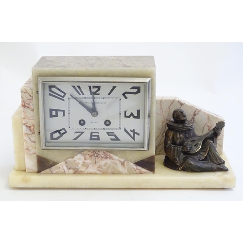 2288 - An Art Deco onyx and marble mantle clock with cased figure of seated Pierrot. The clock dial signed ... 