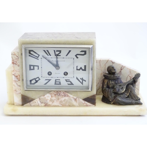 2288 - An Art Deco onyx and marble mantle clock with cased figure of seated Pierrot. The clock dial signed ... 