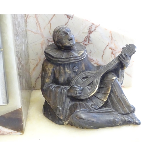 2288 - An Art Deco onyx and marble mantle clock with cased figure of seated Pierrot. The clock dial signed ... 