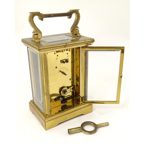 2290 - A brass five glass carriage clock, the white enamel dial  with Roman numerals and inscribed 'Jean Re... 