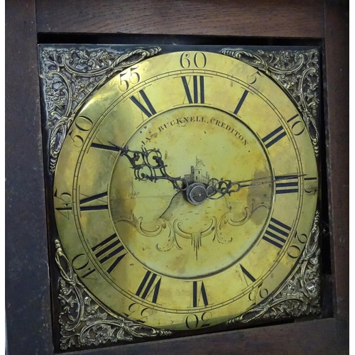 2292 - James Bucknell, Crediton, Devon : An 18thC oak cased longcase clock with 30 hour movement and brass ... 