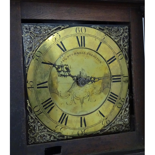 2292 - James Bucknell, Crediton, Devon : An 18thC oak cased longcase clock with 30 hour movement and brass ... 