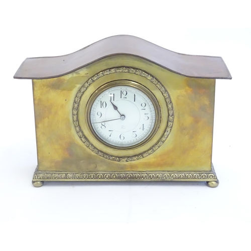 2293 - A mantle clock by Japy freres the shaped brass case with enamel dial marked signed Japy freres mark.... 