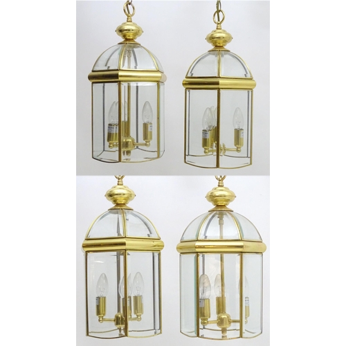 2241 - A set of 4 late 20thC pendant lights, the three branch lights hexagonal formed lantern shades with b... 