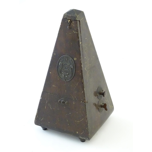 1541 - An early 20thC clockwork metronome, of pyramid form, with maker's plaque 'Metronome nach Maelzel', s... 