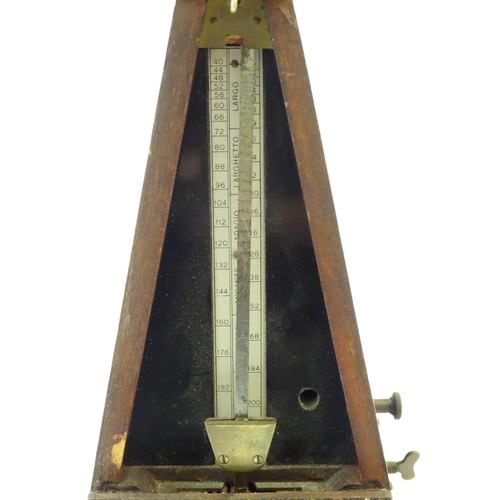 1541 - An early 20thC clockwork metronome, of pyramid form, with maker's plaque 'Metronome nach Maelzel', s... 