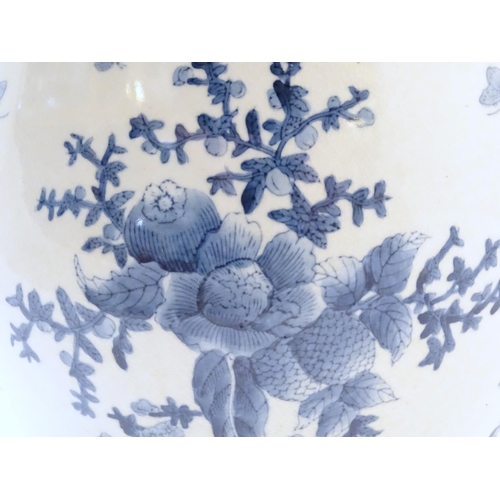 69 - A Chinese blue and white planter / jardiniere decorated with flowers, foliage, insects, fruit and bu... 