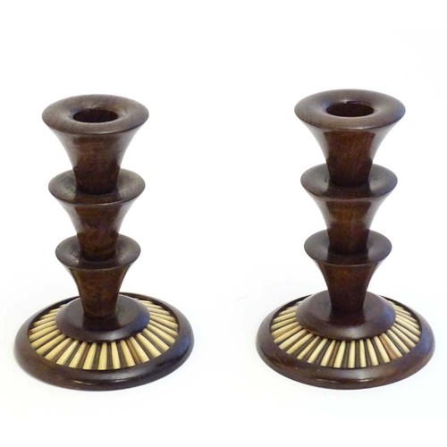 1166 - A pair of 20thC treen candlesticks with stepped columns and porcupine quill detail to base. Approx. ... 