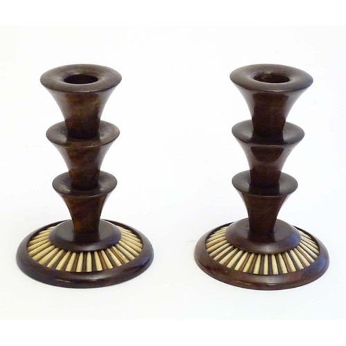 1166 - A pair of 20thC treen candlesticks with stepped columns and porcupine quill detail to base. Approx. ... 