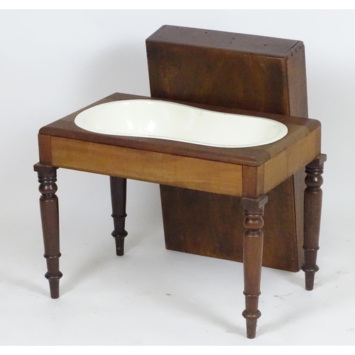 19 - A Georgian mahogany bidet with a rectangular lid above four turned tapering legs. 22