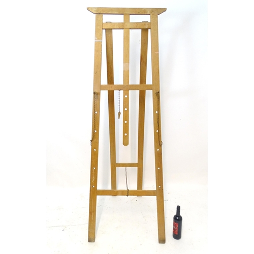 1108 - A 20thC artist's easel. Approx. 73 3/4