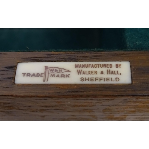 1111 - A Walker & Hall, Sheffield oak cutlery/ flatware box / canteen with four drawers and campaign style ... 