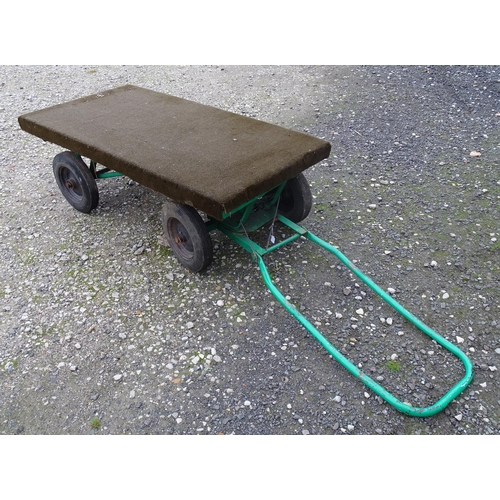 1113 - A grocer's barrow / trolley, the steel frame with four wheels, steering handle and solid platform. T... 