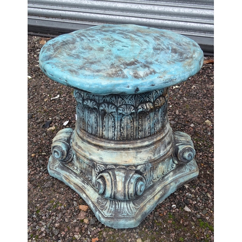 1118 - A reconstituted stone painted garden plant stand formed as an Iconic column capital. Approx. 15 1/2