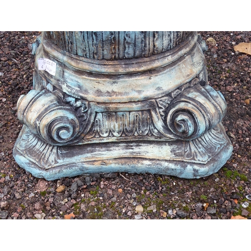 1118 - A reconstituted stone painted garden plant stand formed as an Iconic column capital. Approx. 15 1/2