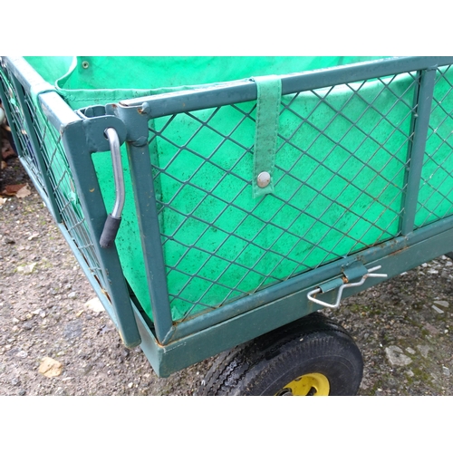 1119 - A garden barrow with four wheels, steering handle and collapsible sides. Approx. 41 1/2