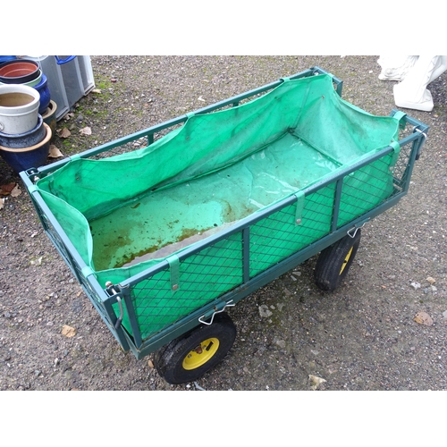 1119 - A garden barrow with four wheels, steering handle and collapsible sides. Approx. 41 1/2