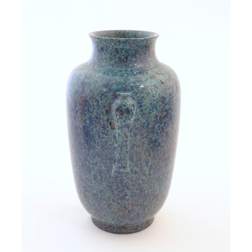 24 - A Chinese vase with moulded twin handles and speckled detail. Impressed character marks under. Appro... 