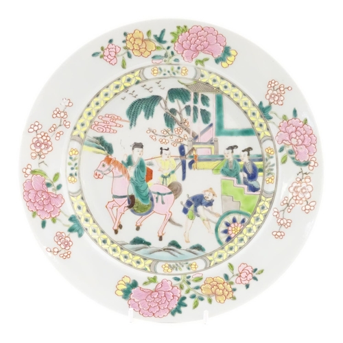 40 - A Chinese famille rose plate depicting a landscape scene with a figure on horse back with an attenda... 